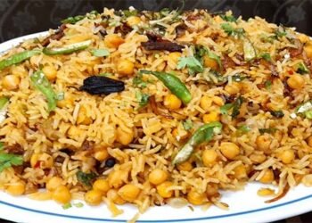 مزیدار چنا پلاؤ پلیٹ میں سجا ہوا